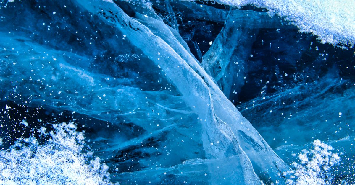 Cryotherapy in Dubai: cracked blue ice on a frozen surface representing cold therapy
